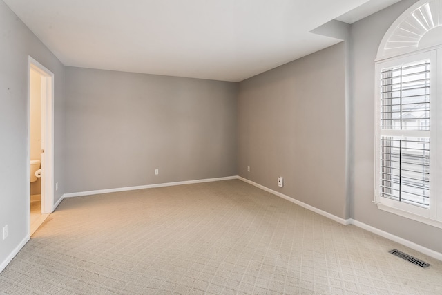 spare room featuring plenty of natural light