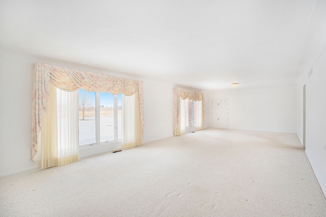 empty room with light colored carpet