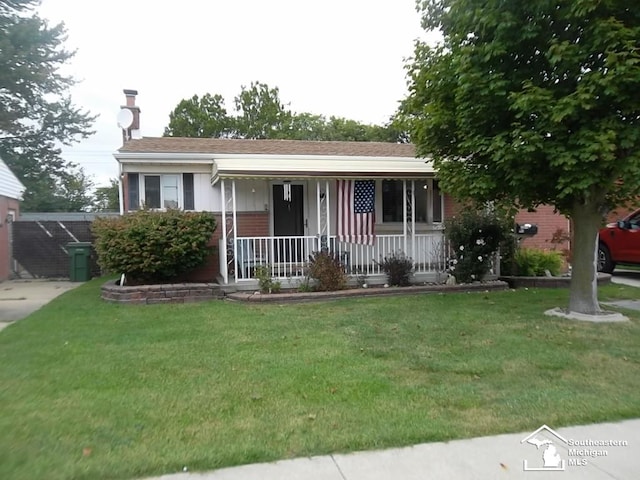 view of front of home featuring a front lawn and a porch