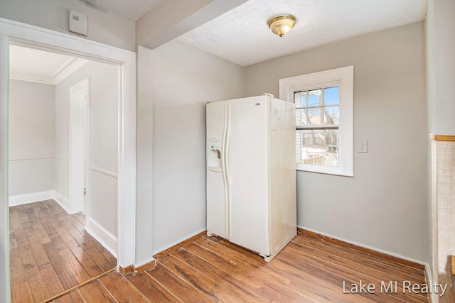 interior space with hardwood / wood-style floors and a textured ceiling