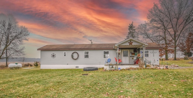 view of front of house with a lawn