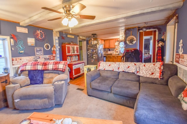 living room with beamed ceiling, ceiling fan, sink, and light hardwood / wood-style floors