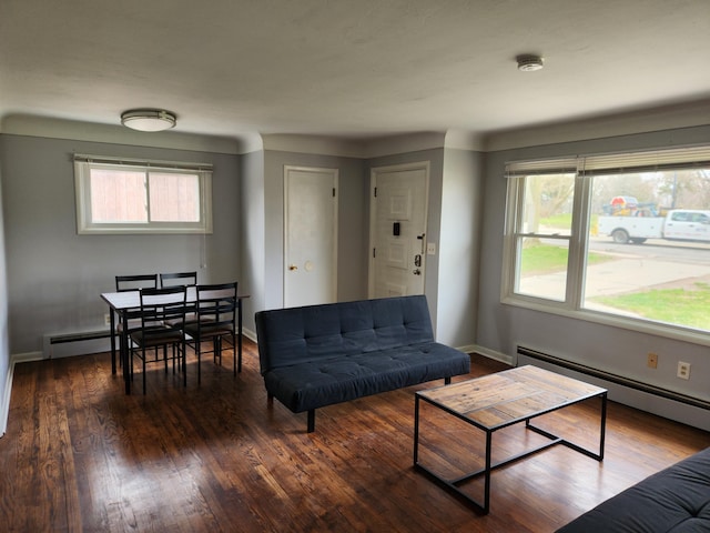 living room with a baseboard radiator and dark hardwood / wood-style floors