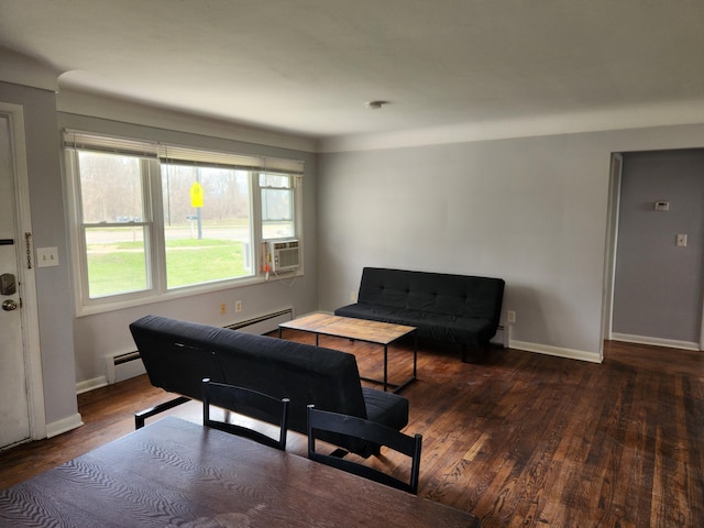 living room featuring dark hardwood / wood-style flooring, cooling unit, and baseboard heating