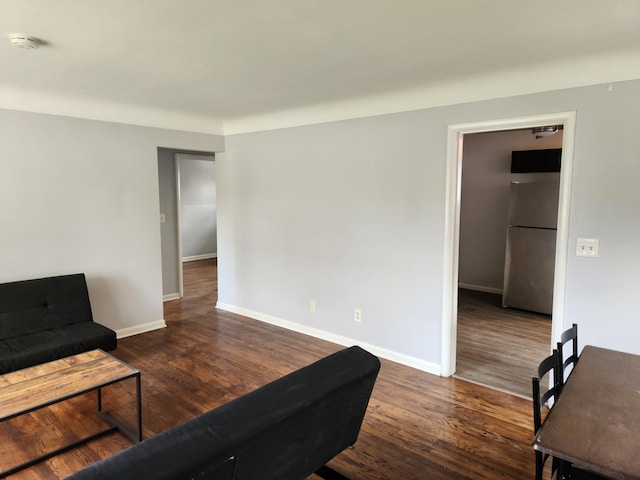 living area with dark wood-type flooring