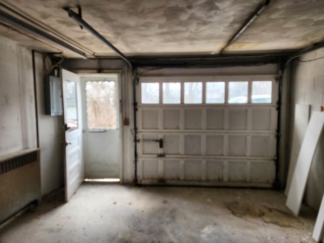 garage featuring radiator and electric panel