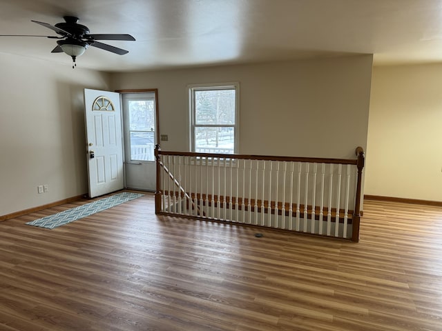 entrance foyer with dark wood-type flooring and ceiling fan