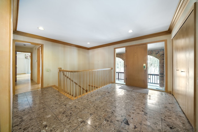 entryway featuring crown molding, recessed lighting, and baseboards