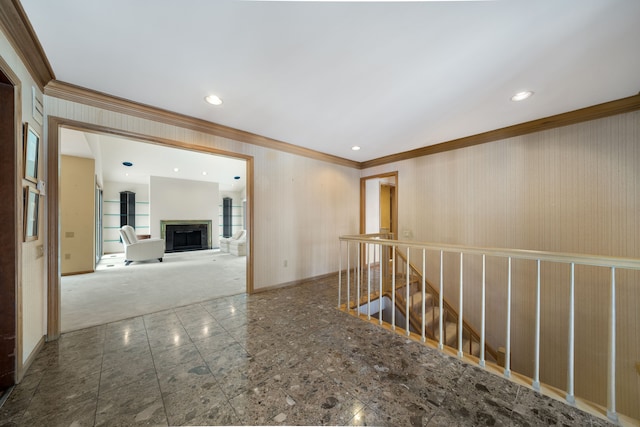 hall with crown molding, baseboards, recessed lighting, and an upstairs landing