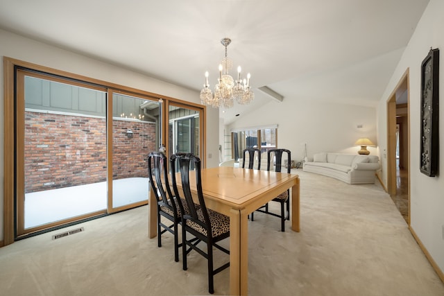 dining space featuring vaulted ceiling, a chandelier, light carpet, and visible vents