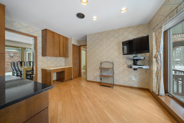 kitchen with recessed lighting, brown cabinetry, light wood finished floors, and plenty of natural light