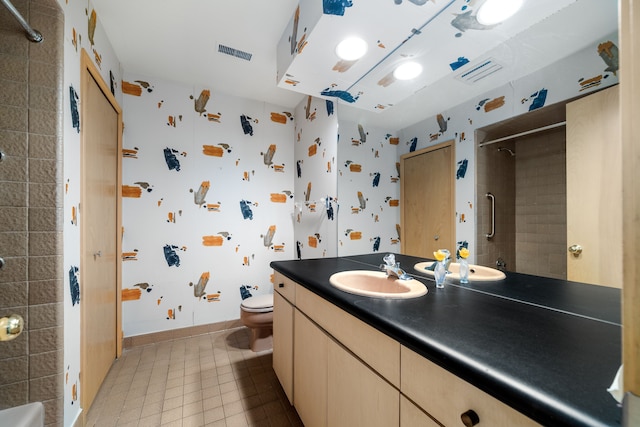 bathroom featuring vanity, toilet, baseboards, a shower, and visible vents