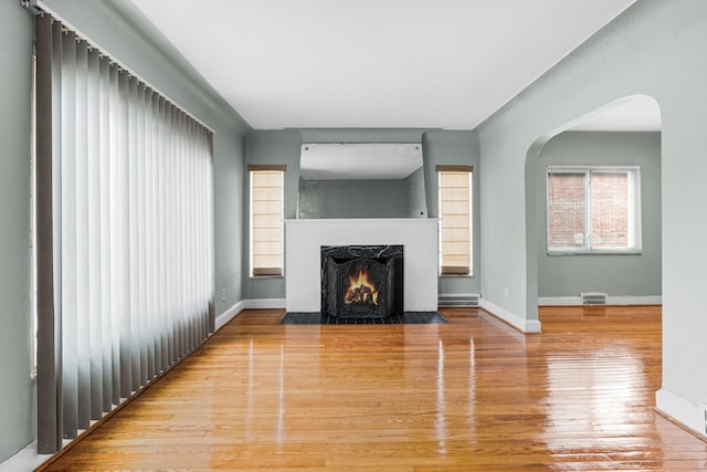 unfurnished living room with light hardwood / wood-style floors