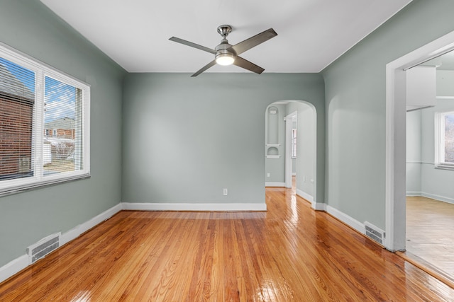 spare room with ceiling fan and light hardwood / wood-style flooring