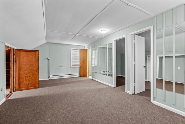 interior space with carpet floors and baseboard heating