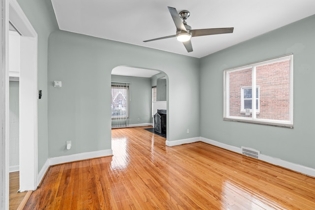 unfurnished living room with ceiling fan and light hardwood / wood-style flooring