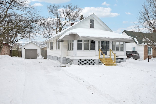 view of front of home with a garage, an outdoor structure, and entry steps