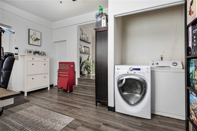 clothes washing area with dark hardwood / wood-style floors and separate washer and dryer