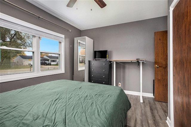 bedroom featuring hardwood / wood-style flooring and ceiling fan