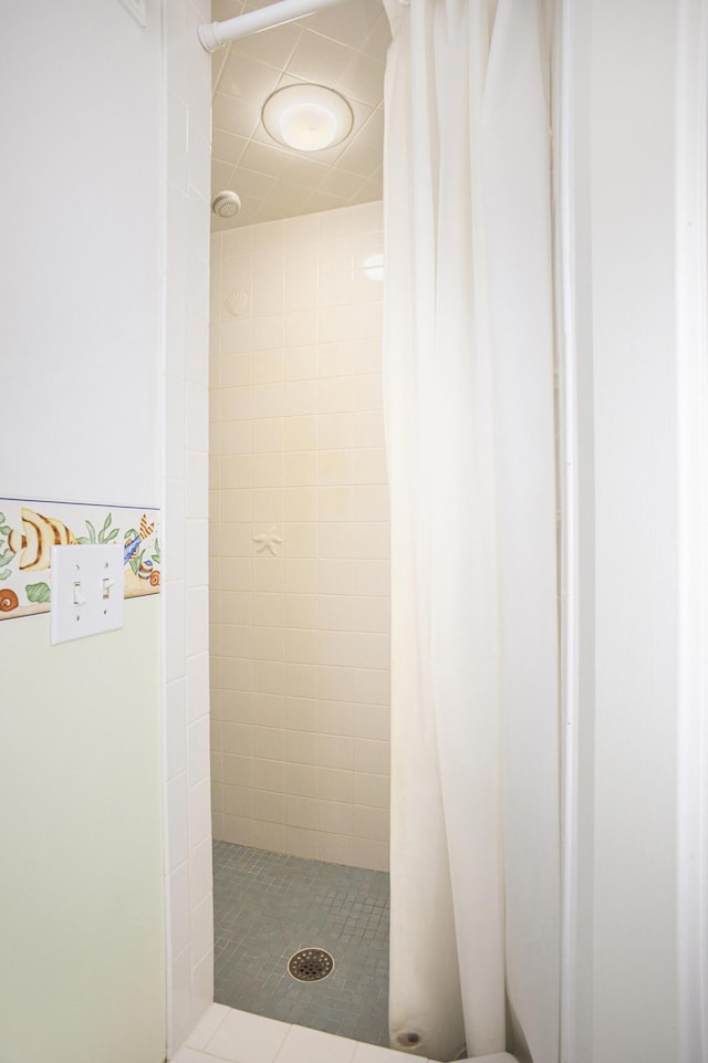 bathroom with a shower with shower curtain