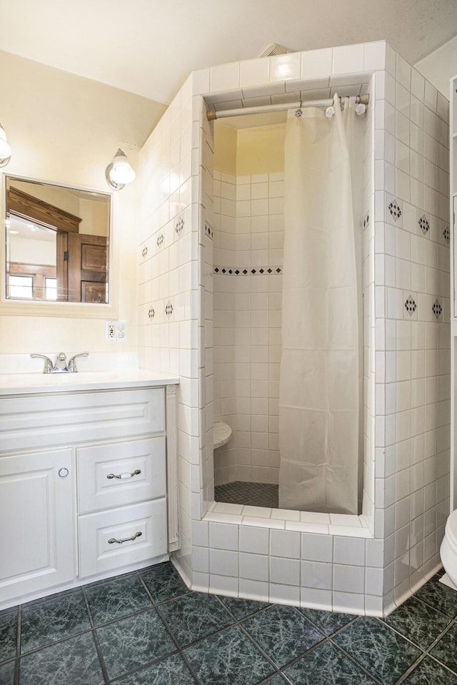 bathroom featuring vanity, toilet, tile patterned flooring, and a shower with shower curtain