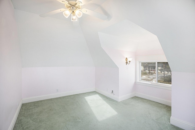 bonus room featuring light carpet, vaulted ceiling, and ceiling fan