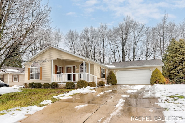 ranch-style house with a garage and covered porch