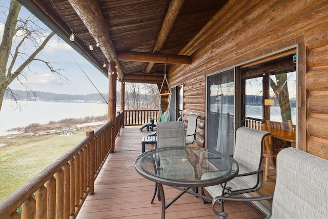 wooden deck featuring a water view