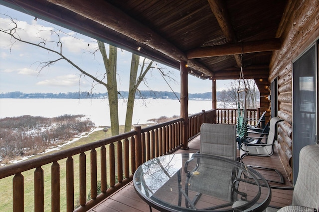 wooden deck with a water view