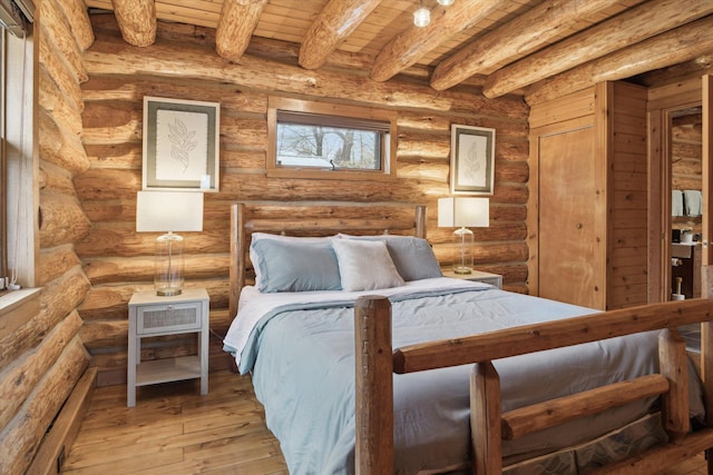 bedroom featuring light hardwood / wood-style flooring, wooden ceiling, rustic walls, and beamed ceiling