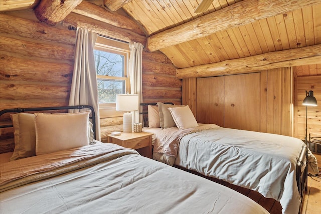 bedroom featuring hardwood / wood-style floors, wood ceiling, and lofted ceiling with beams