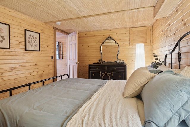 bedroom with wooden ceiling and wood walls