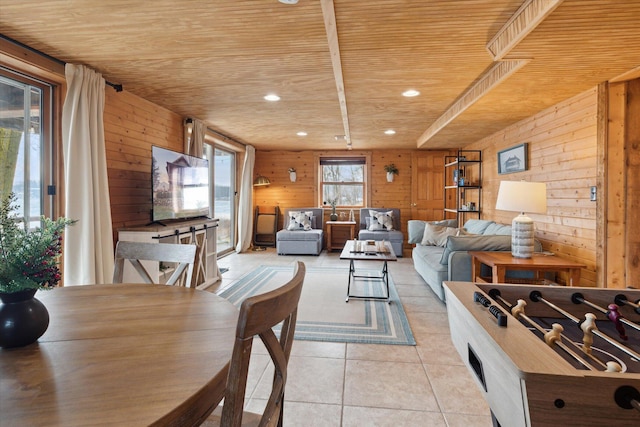 living room featuring light tile patterned floors, wood ceiling, and wood walls