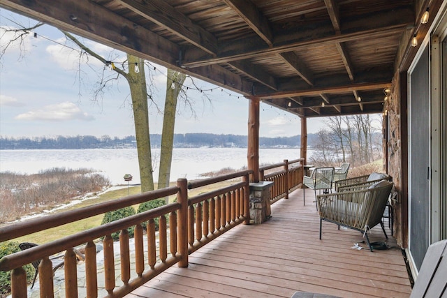 wooden deck featuring a water view