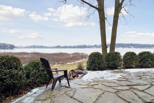 view of patio with a water view