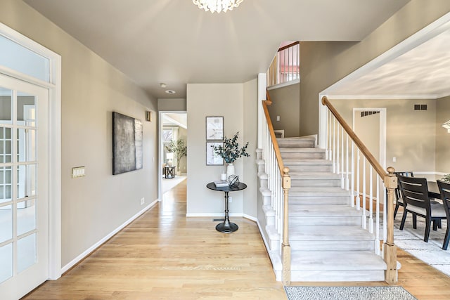 stairs with hardwood / wood-style flooring