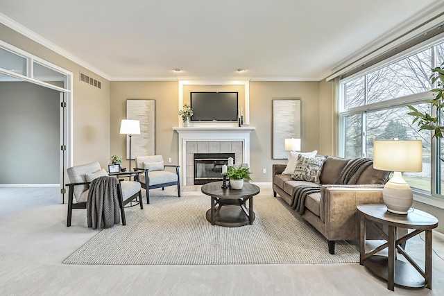 living room with light colored carpet, ornamental molding, and a fireplace