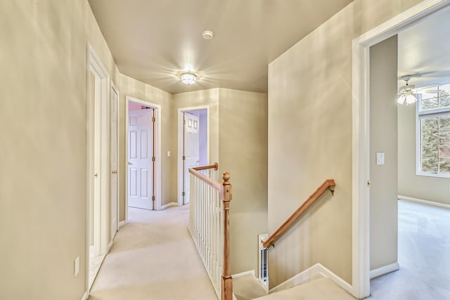 corridor with light colored carpet