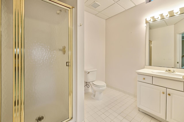 bathroom with a drop ceiling, tile patterned floors, and walk in shower