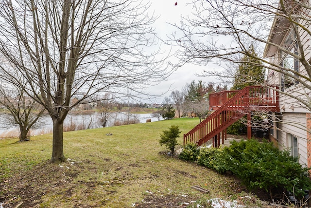 view of yard featuring a deck with water view