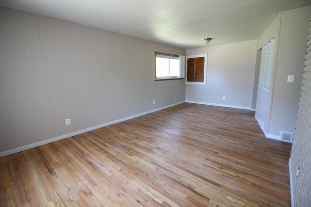 spare room featuring light hardwood / wood-style flooring