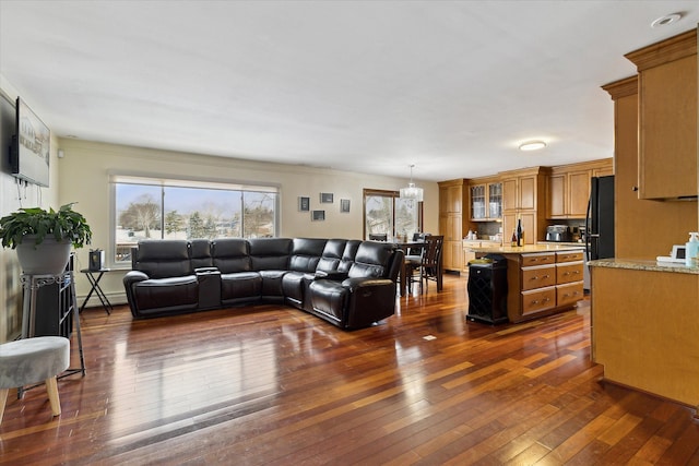 living room featuring dark wood-style floors and baseboard heating