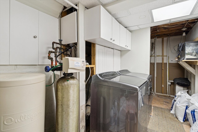 laundry room featuring cabinet space and separate washer and dryer