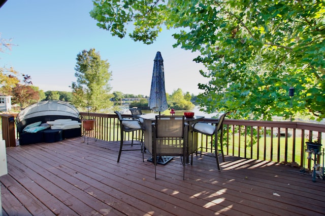 deck with outdoor dining area