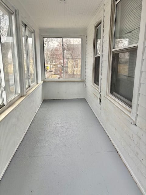 unfurnished sunroom featuring a wealth of natural light