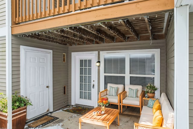 view of patio with outdoor lounge area and a balcony