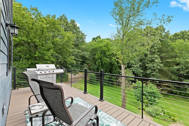 wooden terrace with a lawn