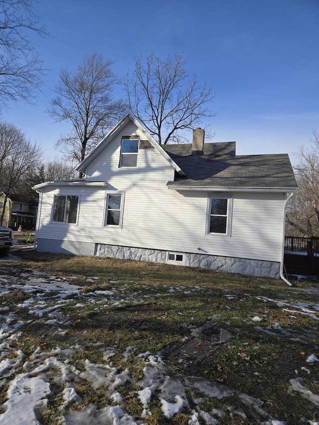 view of home's exterior with a chimney