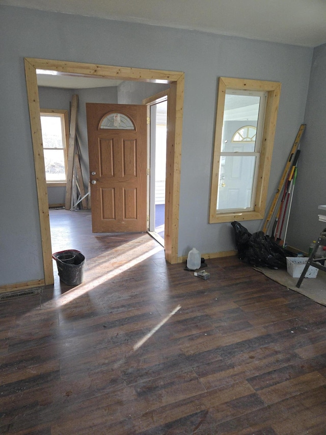 entryway with wood finished floors