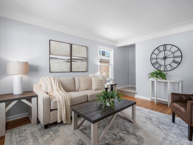 living area with wood finished floors and baseboards